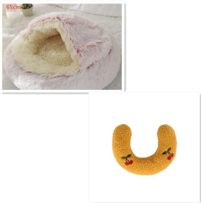 Plush pet cave bed and yellow U-shaped pet pillow with cherry embroidery.