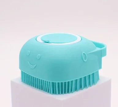 Aqua blue pet grooming brush with a cute face design and silicone bristles for dogs and cats