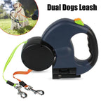 Retractable dual dog leash with ergonomic handle and two leashes, for walking two dogs.