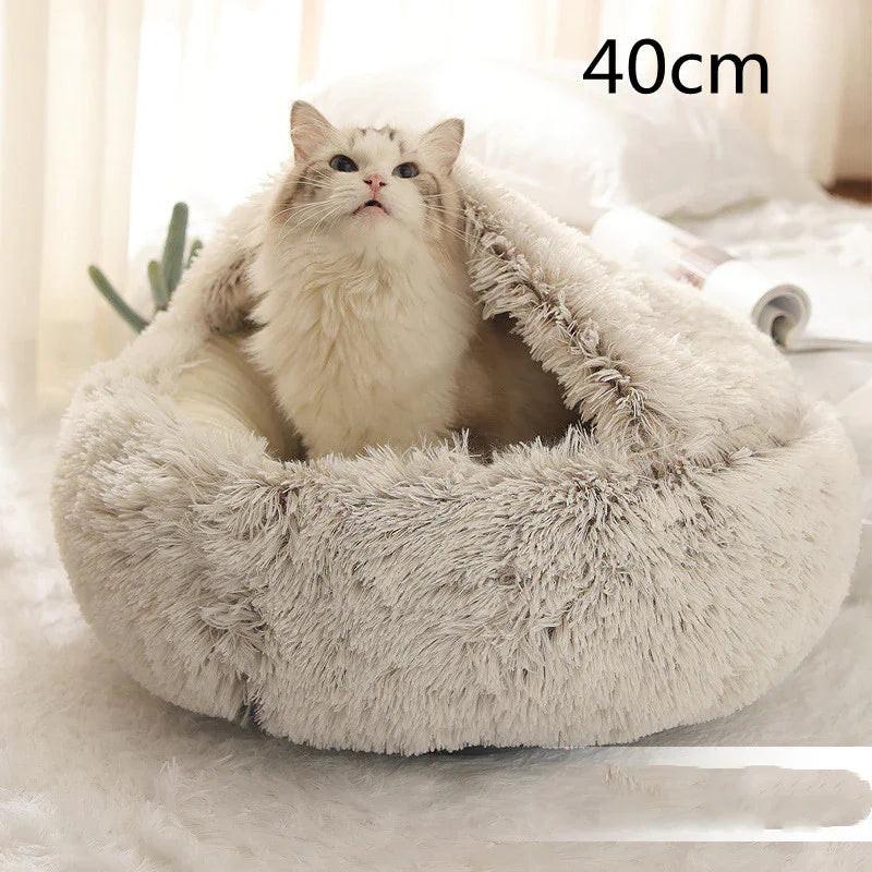 Fluffy white cat in a soft, round 40cm plush pet bed on a cozy indoor rug