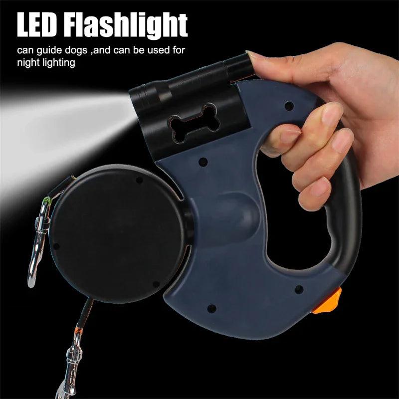 Hand holding retractable dog leash with built-in LED flashlight for night walking
