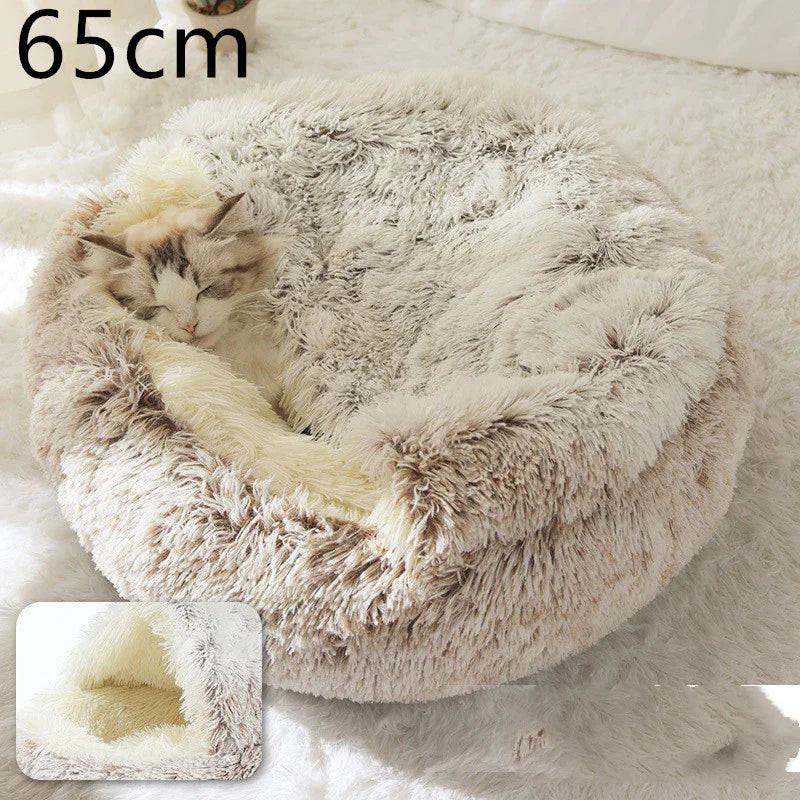 Cat sleeping in a fluffy round pet bed, 65cm size, on a soft white surface