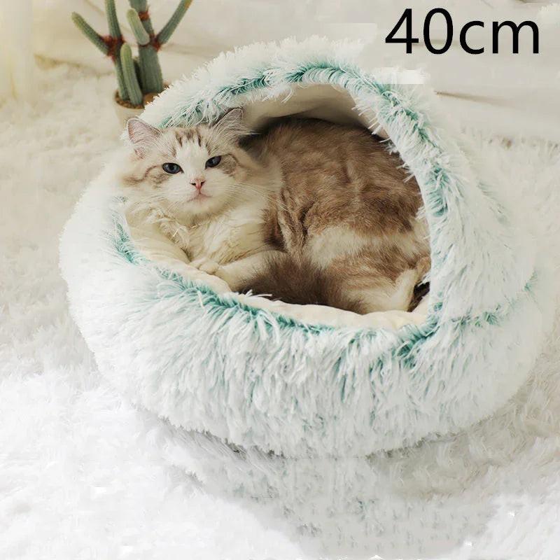 Fluffy cat relaxing in cozy white and teal covered cat cave bed, 40cm size, on soft rug