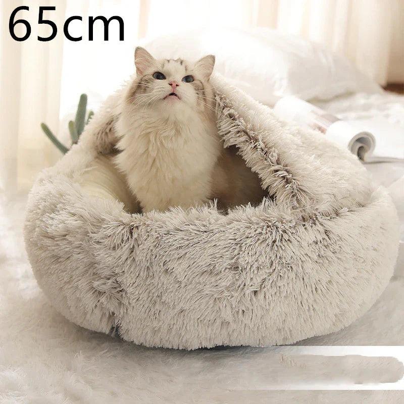 Fluffy white cat in a soft, round, hooded pet bed, 65cm, on a cozy indoor floor