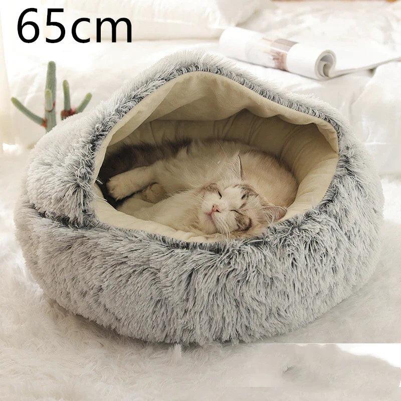 Cat sleeping in a cozy grey fluffy pet cave bed, 65cm, on a white rug