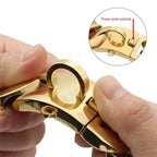 Close-up of hands unlocking a gold stainless steel dog chain collar with quick-release clasp.