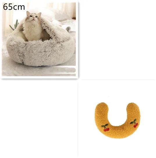 Fluffy white cat in cozy faux fur cat bed and yellow U-shaped pet pillow with cherry embroidery.