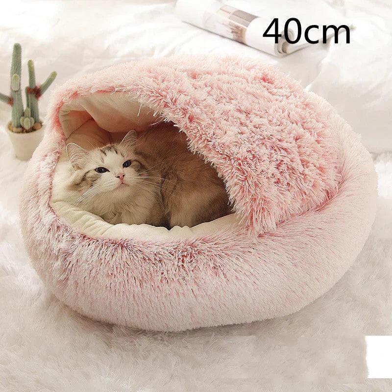 Cat relaxing in a pink fluffy pet bed cave, 40cm, cozy indoor cat sleeping pod.
