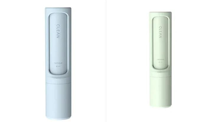 Two sleek, modern pet hair remover rollers in white and off-white on a plain background.