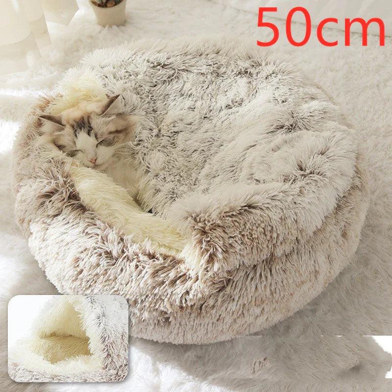 Cat sleeping in a fluffy round pet bed, beige and white, 50cm, cozy indoor setting.