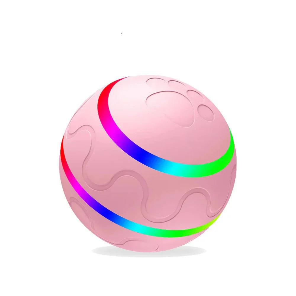 Pink interactive pet toy ball with rainbow LED lights and paw print design on white background