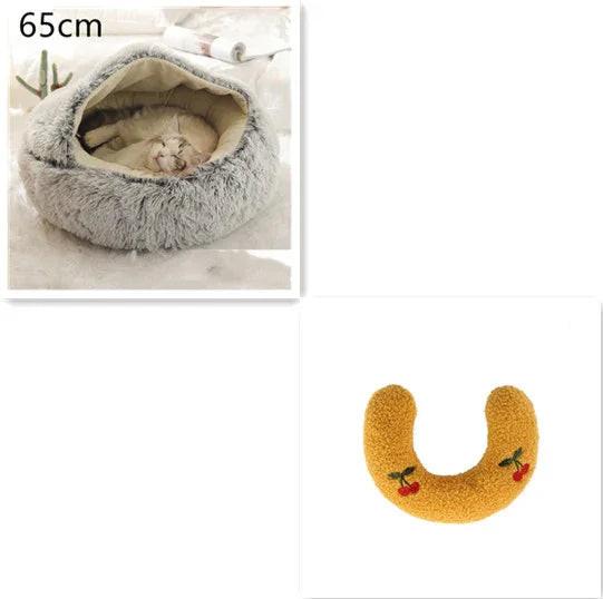 Cozy grey cat bed with sleeping cat and yellow U-shaped pet pillow with cherry embroidery