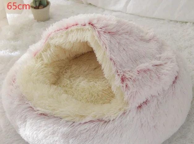 Soft, fluffy pet cave bed in cream and pink, cozy for cats or small dogs, 65cm size.