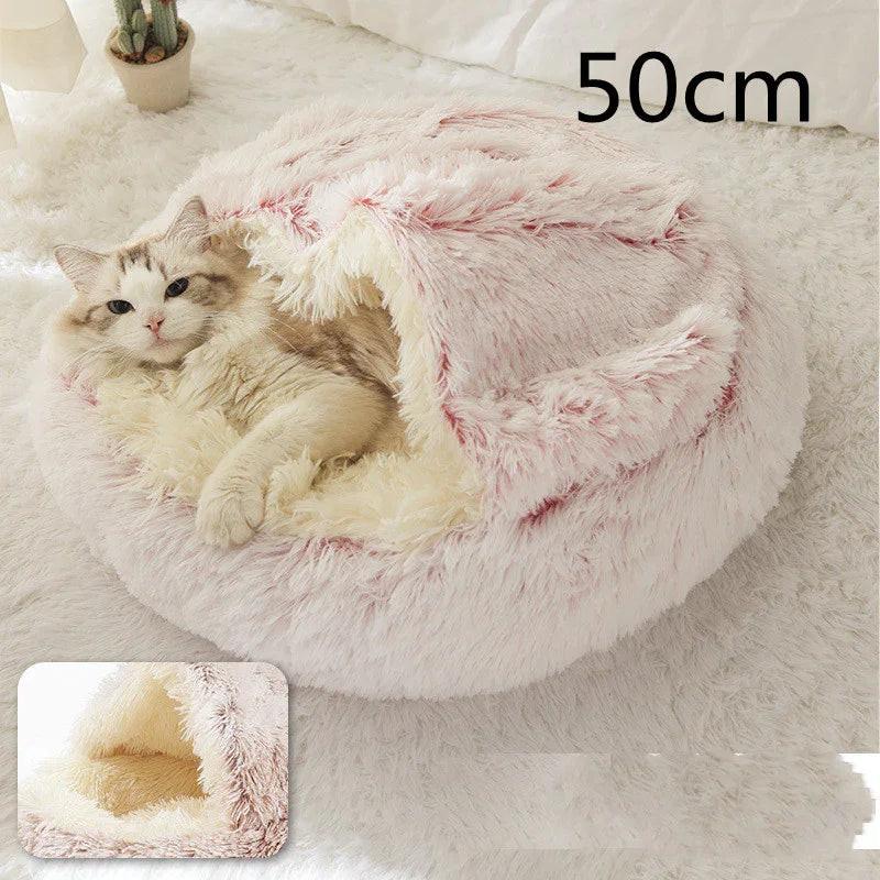 Cat in a soft, fluffy pink and cream pet bed cave, cozy indoor pet sleeping mat, 50cm size.