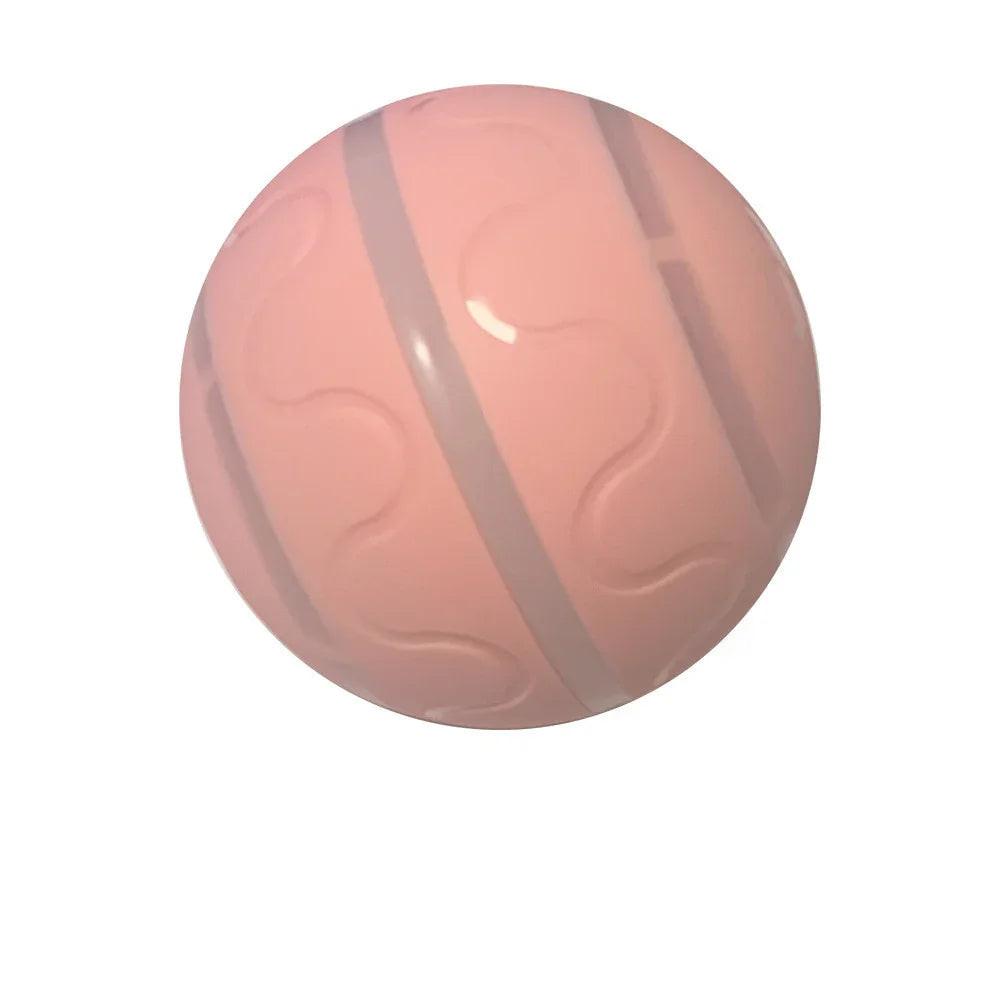 Pink interactive pet toy ball with textured grooves, isolated on white background