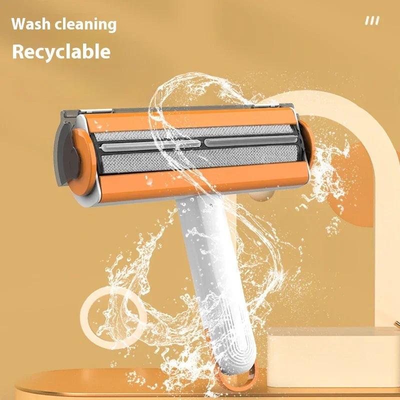 Washable recyclable pet grooming brush with orange and white handle, surrounded by water splash
