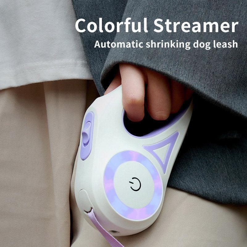 Person holding a pastel purple automatic retractable dog leash with illuminated accents