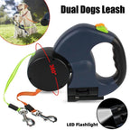 Dual retractable dog leash with 360° swivel, LED flashlight, orange and green leads