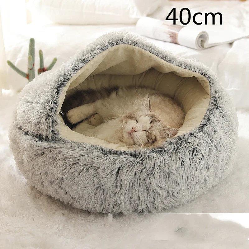 Cat sleeping in a cozy, grey, fluffy covered pet bed, 40cm size, in bright room.