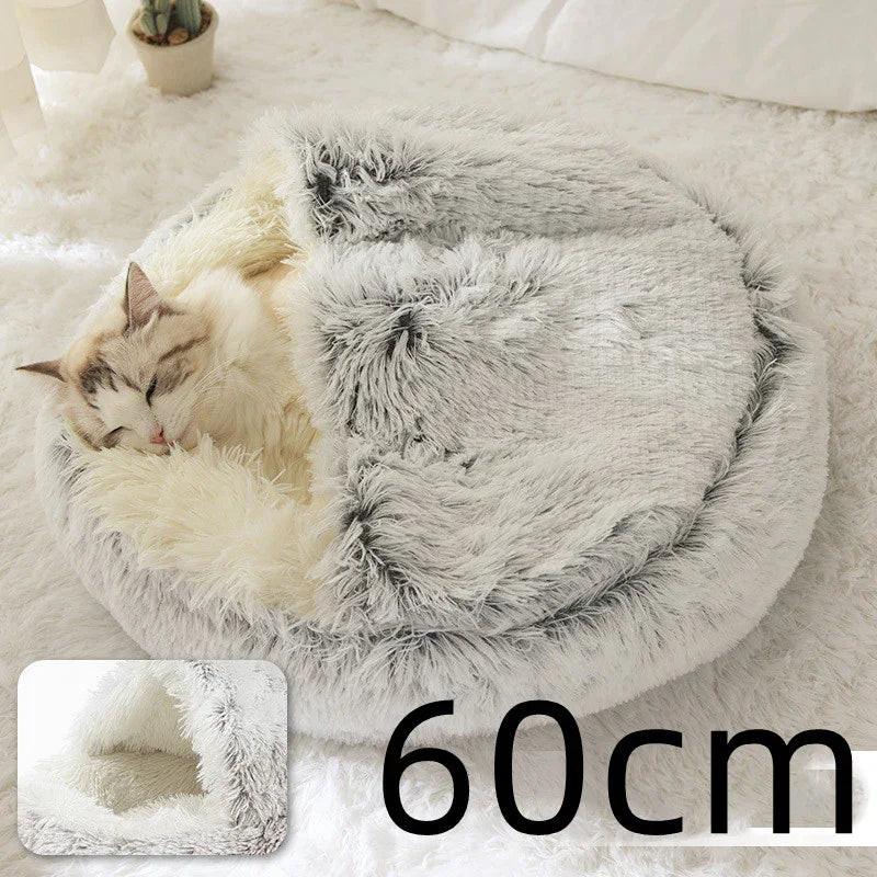 Cat sleeping in a soft, round, grey faux fur pet bed, 60cm size, cozy indoor setting
