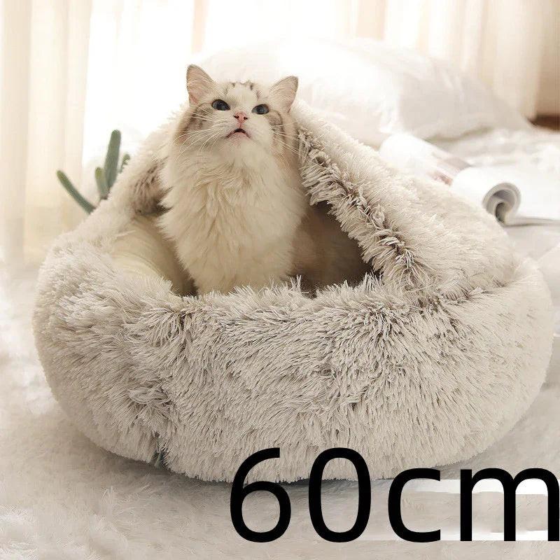 Fluffy white cat in a cozy, round 60cm plush pet bed on a soft indoor surface
