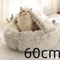 Fluffy white cat in a cozy, round 60cm plush pet bed on a soft indoor surface