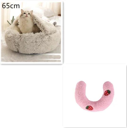 Fluffy cat in a 65cm cozy pet bed and a pink U-shaped pillow with embroidered strawberries.