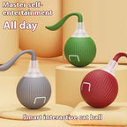 Smart interactive cat toy balls in red, green, and gray with flexible tails, on a beige background.